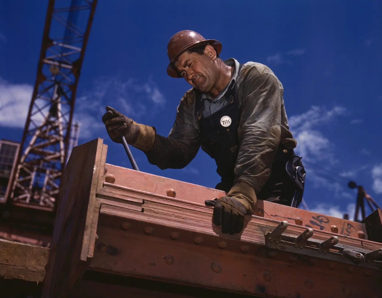A builder working on a timber structure.