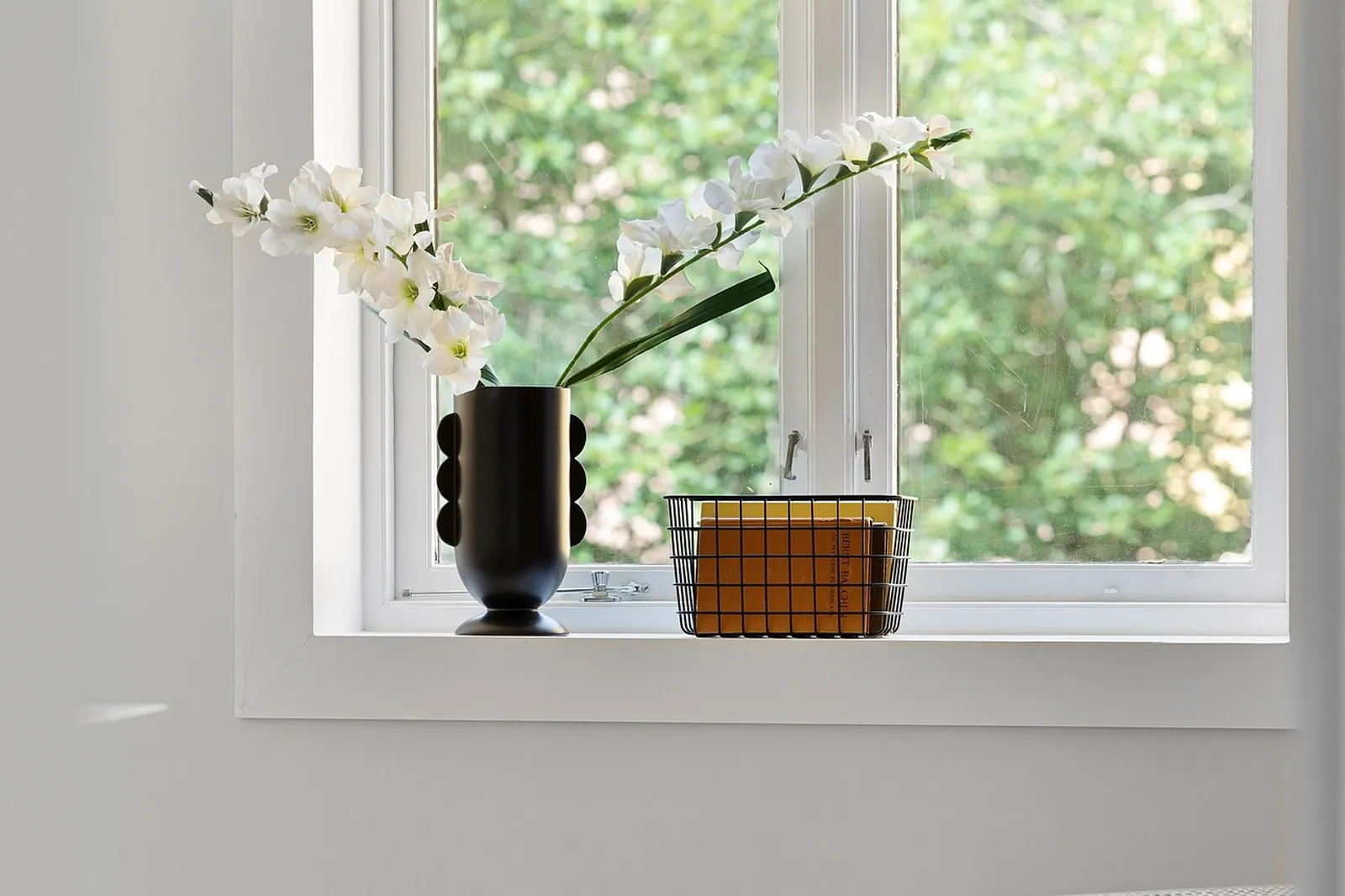 A ceramic vase on a shelf.