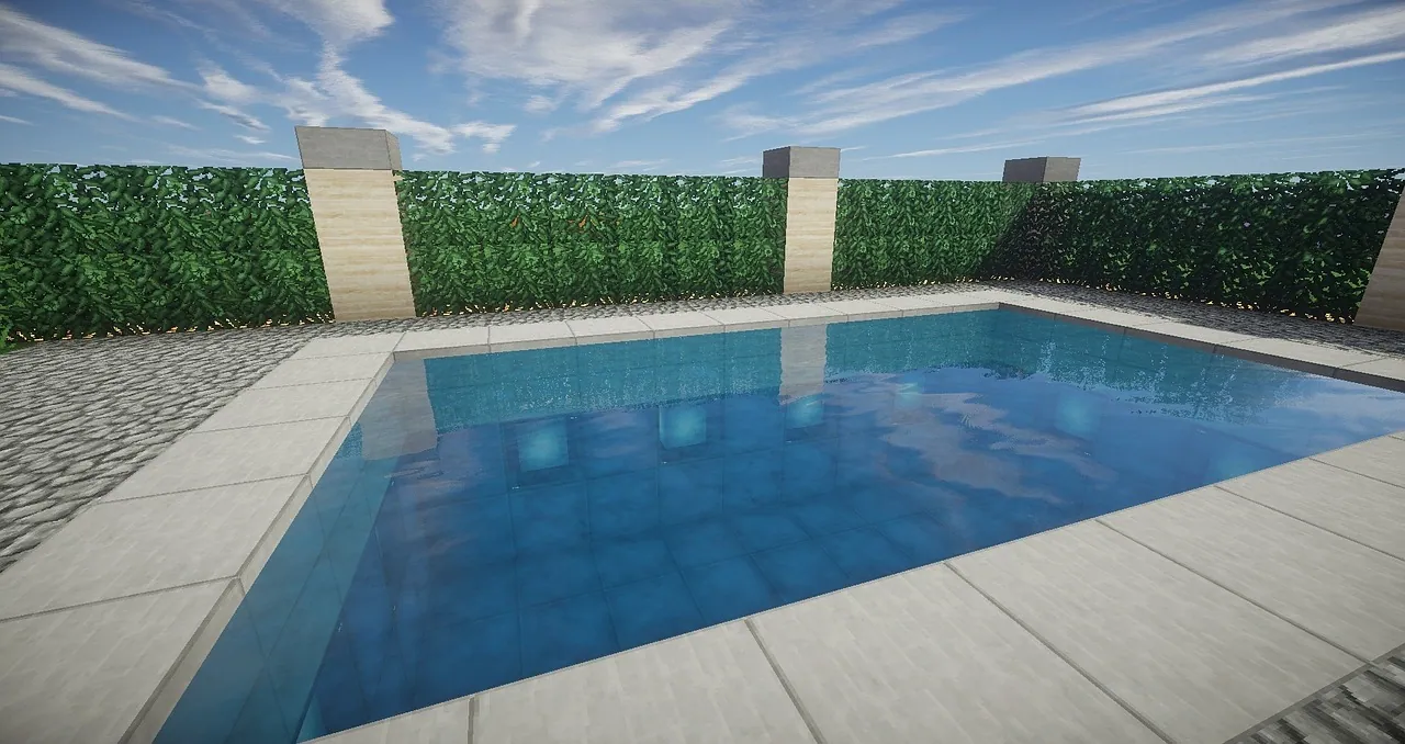 A house with a swimming pool and hedge.