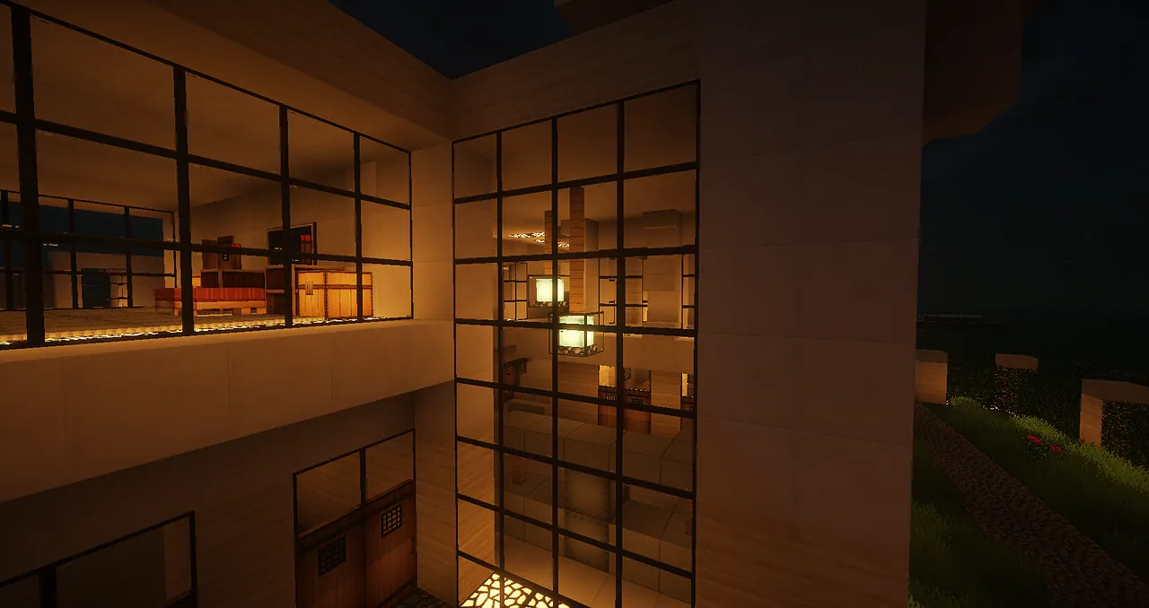 A modern house with large glass windows at dusk.