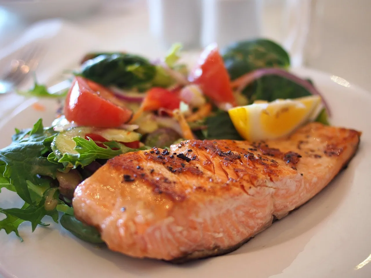 Salmon with a green salad.