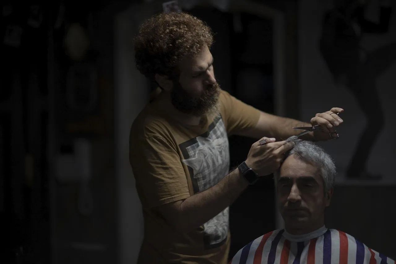 A stylist working on a client's hair.